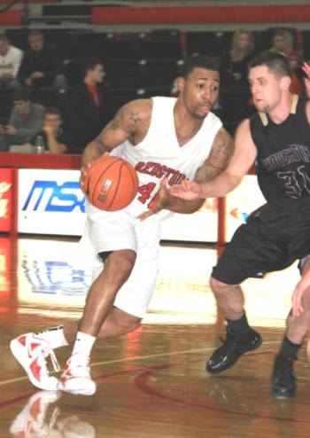 Rio Grande's Brad Cubbie drives past Houghton's Mark O'Brien during Thursday night's 83-59 win.