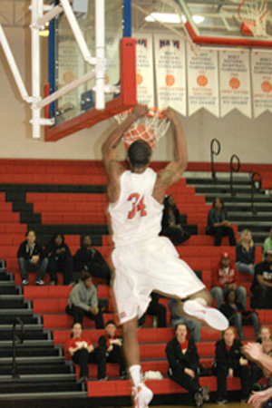 Rio Grande's Turrell Morris goes airborne for a dunk in Saturday's win over WVU Tech.