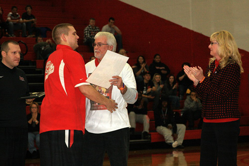 Rio Grande's Ethan Prater receives the Corey Taylor Heart & Hustle Award prior to a recent game with Pikeville