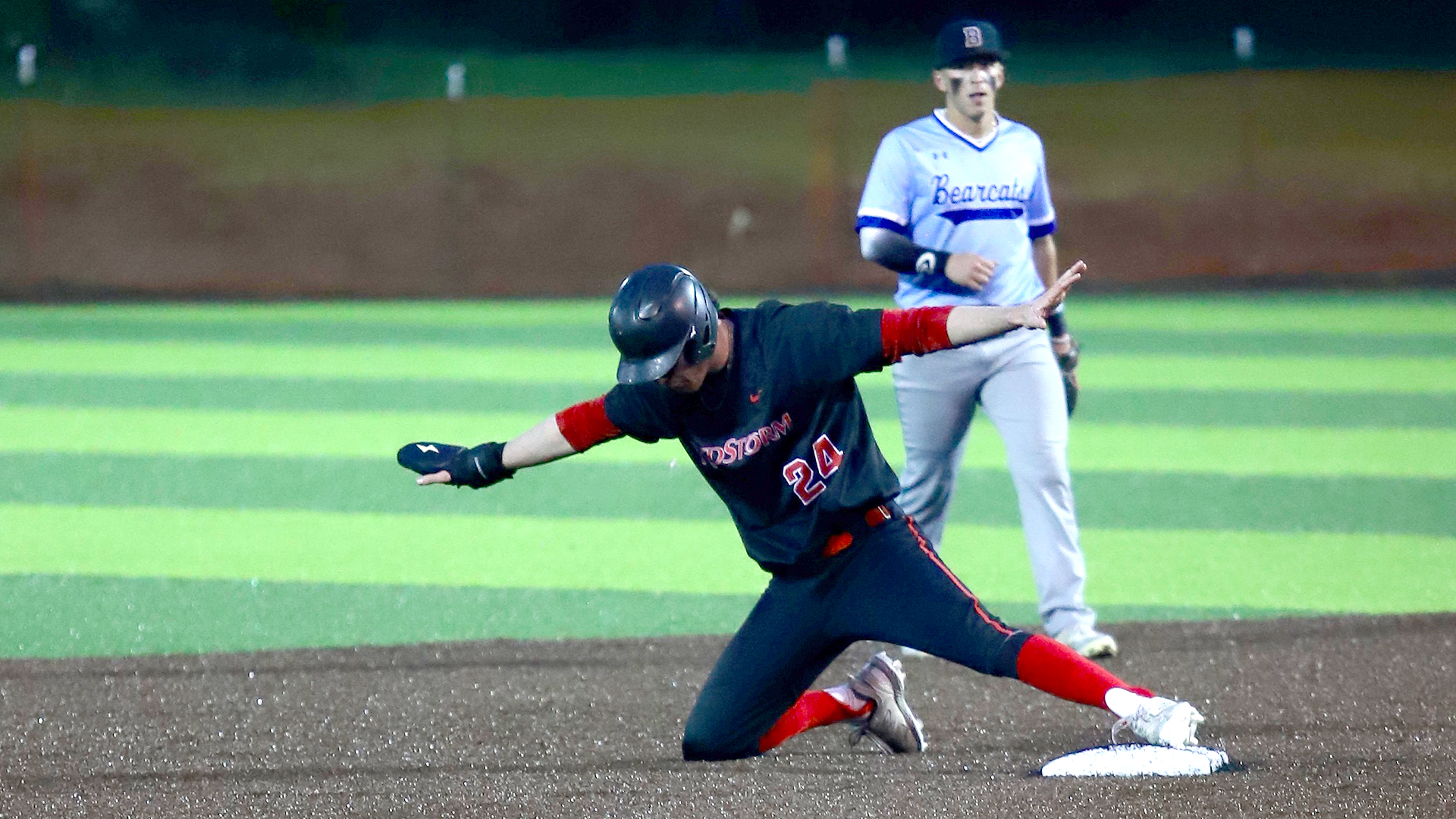 Rio Grande's Chase Christian gives the safe signal after sliding into second base during Sunday night's 10-inning loss to Brescia University at VA Memorial Stadium in Chillicothe, Ohio.