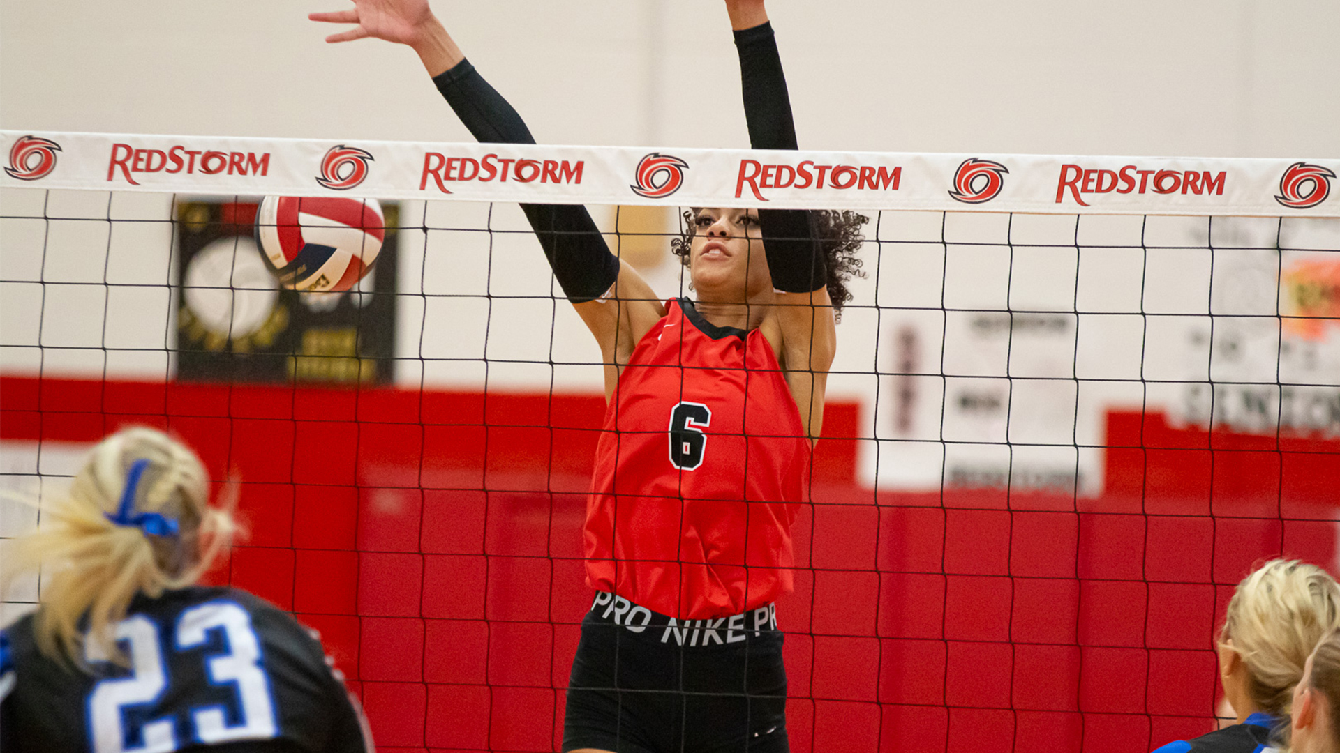 Rio Grande's Jordan Brooks goes airborne for a block attempt in Saturday's straight sets win over Alice Lloyd at the Newt Oliver Arena.